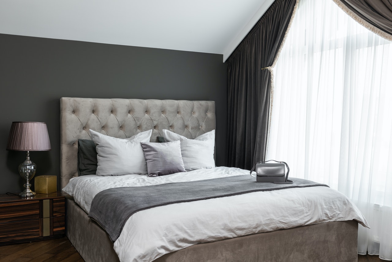 Modern bedroom with lots of gray paint color