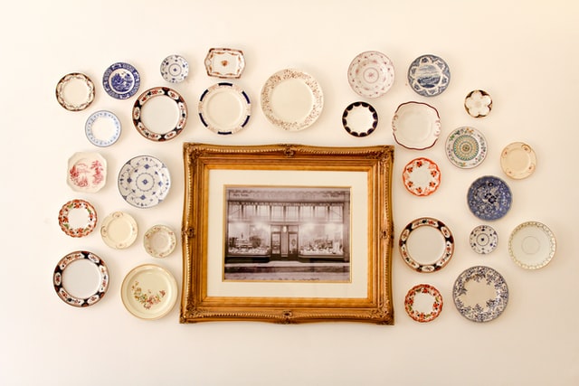 Different plates hung on a wall