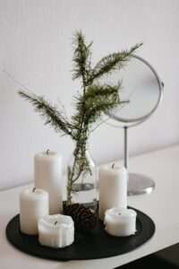 A tray with candles and other budget bedroom decoration items