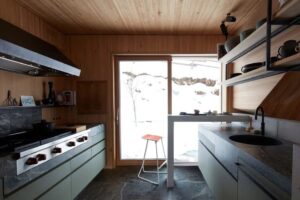 A kitchen designed using locally sourced stone and timber