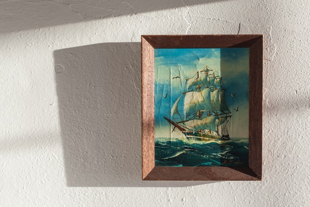 Painting of a ship in the ocean