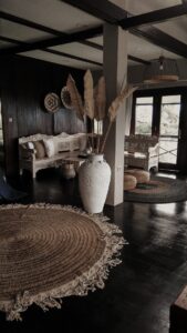 Black floorboards in an antique-inspired living room