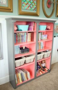 A pink and gray bedroom cabinet