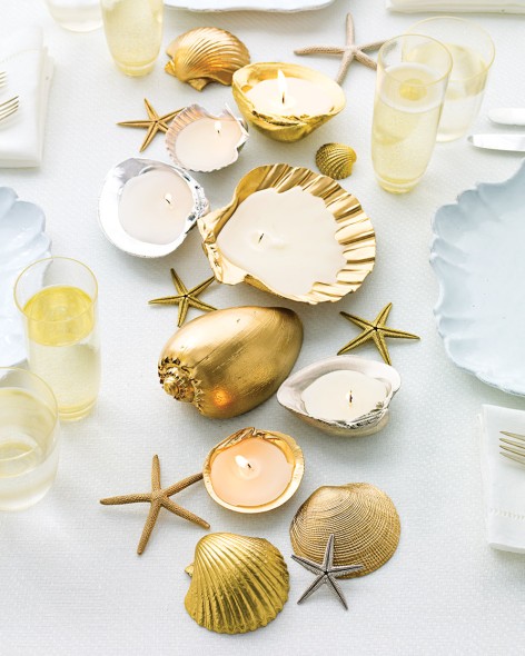 Shell candles on a table for summer decor