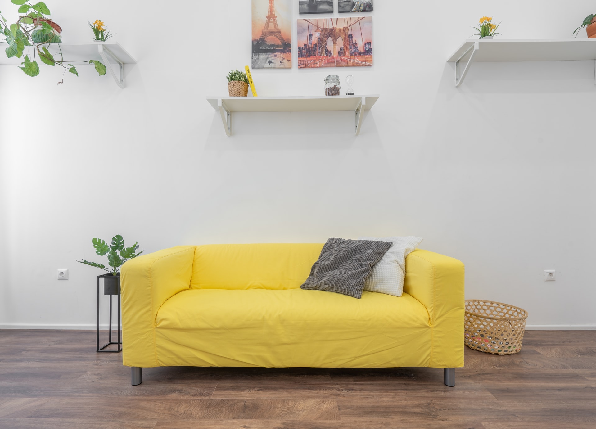 A yellow sofa inside a summer living room