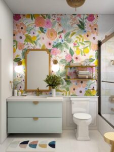 A botanical wallpaper on a bathroom wall above the sink