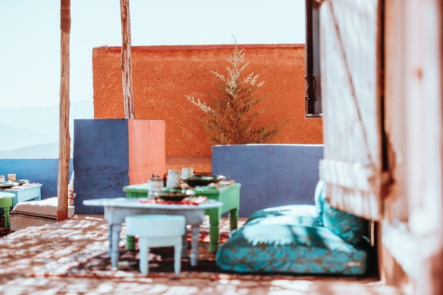 Small tables and stools in a colorful patio