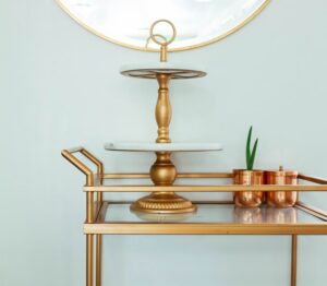 Gold colored home decorating items on a table
