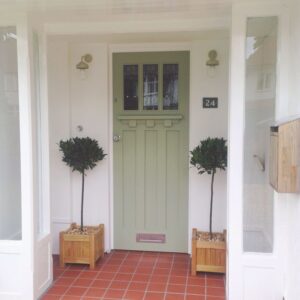 Front door painted in a Dulux colour match to Farrow and Ball Lichen.
