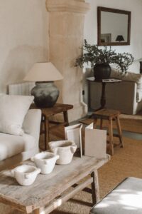 Three pots, a rustic wooden table in a living room